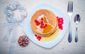 Stack of fresh golden pancakes or flapjacks topped Royalty Free Stock Photo