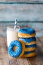 A stack of fresh homemade donuts with blue chocolate coating and sprinkles. Royalty Free Stock Photo