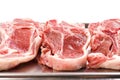 Stack of fresh lamb loin chops. Close up. Meat industry. The product is on a metal tray, Butcher craft