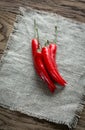 Stack of fresh red chili peppers on the burlap Royalty Free Stock Photo