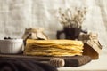 A stack of fresh Russian pancakes for Shrovetide with jam, honey and willow branches. Pancake week. On a wooden Board in the Royalty Free Stock Photo