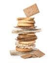 Stack of fresh rye crispbreads, crunchy rice cakes and rusks on white background Royalty Free Stock Photo