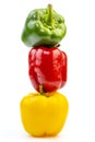 Stack of Fresh Vegetables Three Sweet Red, Yellow and Green Bell Peppers Isolated on White Background. Royalty Free Stock Photo