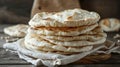 Stack of freshly baked flatbread on a wooden surface Royalty Free Stock Photo