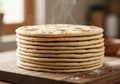 A stack of freshly baked flatbreads rests on a wooden cutting Royalty Free Stock Photo