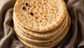 Stack of Freshly Baked Naan Bread on a Rustic Cloth Royalty Free Stock Photo