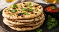 Stack of Freshly Baked Naan Bread Topped with Cilantro and Served with Spicy Dip indian bread flatbread Royalty Free Stock Photo