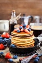 Stack of freshly prepared banana pancakes with fresh berries Royalty Free Stock Photo