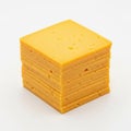A stack of freshly sliced cheddar cheese is neatly arranged on a white background. The cheese has a vibrant orange color and a Royalty Free Stock Photo