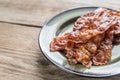 Stack of fried bacon strips on the plate Royalty Free Stock Photo