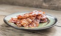 Stack of fried bacon strips on the plate Royalty Free Stock Photo