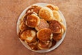 Stack of fried pancakes on a white plate