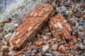 Stack of frosted old, used, perforated bricks and pieces of wall