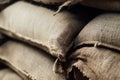 Stack of full burlap bags in stock Royalty Free Stock Photo