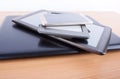 Stack of gadgets on an office desk Royalty Free Stock Photo