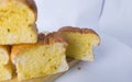 stack of garlic bread on cutting board with white background Royalty Free Stock Photo