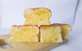 stack of garlic bread on cutting board with white background Royalty Free Stock Photo