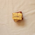 Stack of gift boxes on natural cotton fabric background