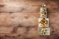 Stack of gift or present boxes in the form of Christmas tree on wooden table top view. Celebration Christmas or New year concept Royalty Free Stock Photo