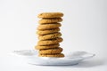 A stack of ginger cookies on a white plate isolated on a white background with copy  space Royalty Free Stock Photo