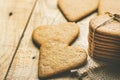 Stack of Ginger Heat Shape Cookies Tied with Twine on Burlap on Weathered Wood Background. Valentine