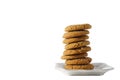 A stack of gingerbread cookies on a white plate isolated on white background with copy space