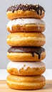 Stack of Glazed Donuts with Chocolate and White Icing Royalty Free Stock Photo