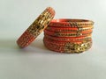 Stack of gold bangle with vivid color and rhinestone isolated on white background Royalty Free Stock Photo