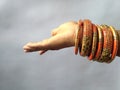 Stack of gold bangle with vivid color and rhinestone on white background