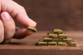 Stack of gold bar on wood background Royalty Free Stock Photo