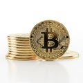 Stack of Gold Bitcoin Cryptocurrency Coins with One Coin in Foreground on White Background Royalty Free Stock Photo