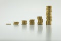 Stack of gold coins, six rows on white background with clipping path. Growing and saving money concept Royalty Free Stock Photo