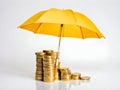 A stack of gold-colored coins protected by an umbrella Royalty Free Stock Photo