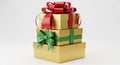 Stack of Gold Gift Boxes Wrapped with Red and Green Ribbons Royalty Free Stock Photo