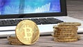 Bitcoin closeup, golden coins, laptop and charts in the background Royalty Free Stock Photo