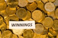 Winnings sign at a coin stack