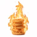A stack of golden deep-fried onion rings burning with bright fire Royalty Free Stock Photo