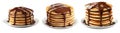 Stack of golden pancakes covered in thick chocolate syrup, isolated on white background, concept of sweet breakfast Royalty Free Stock Photo