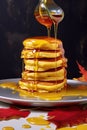 stack of golden pancakes with syrup drizzle