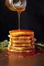 stack of golden pancakes with syrup drizzle
