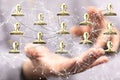 Stack of golden social media follower icons flying over the palm of a man Royalty Free Stock Photo