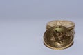 stack of golden valueable bitcoins from crypto currency detail view with gray