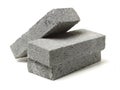 Stack of gray clay bricks for construction