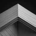 A stack of gray, lined paper viewed from the corner, creating a geometric effect. The Royalty Free Stock Photo