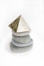 Stack of gray stones on a white background