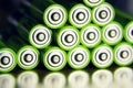Stack of green AA batteries close up, electricity storage concept Royalty Free Stock Photo