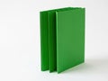 Stack of green binders isolated on white background Royalty Free Stock Photo