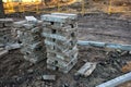 Stack of grey concrete curbs on construction site Royalty Free Stock Photo