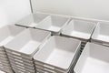 Stack of grey plastic trays arrangement for background. Royalty Free Stock Photo