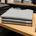 Stack of Grey T-Shirts with \'AI Generated\' Labels Royalty Free Stock Photo